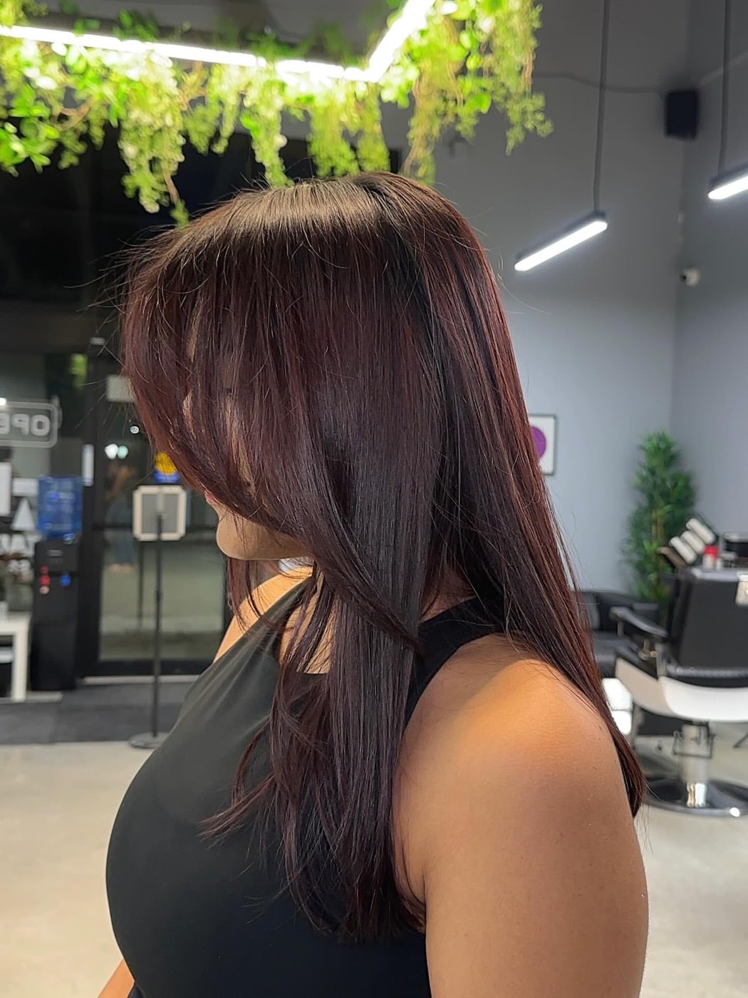 A burgundy colour and money-piece styled at Artistly