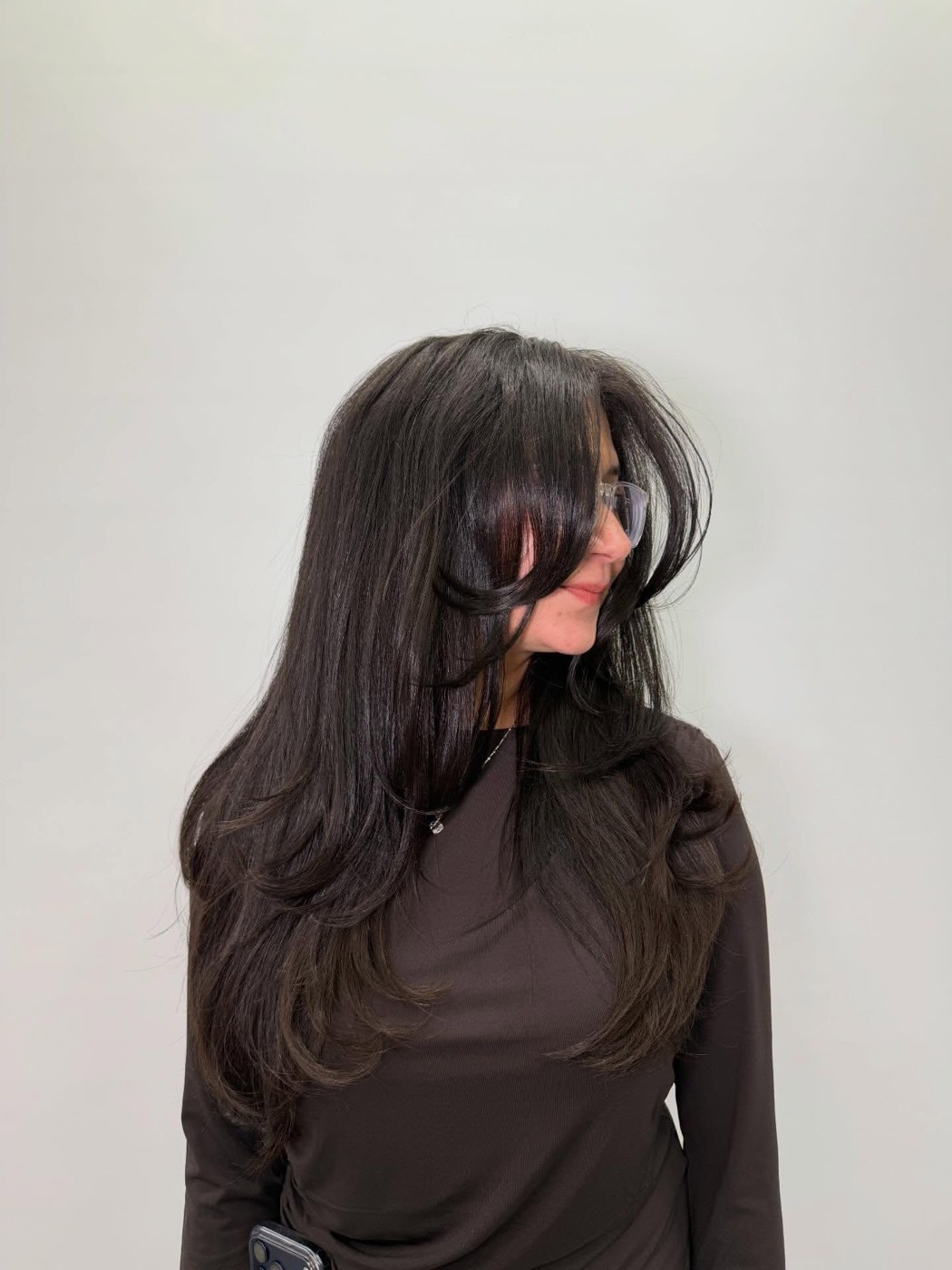 Glass-smooth, high-shine finish on long dark hair at Artistly