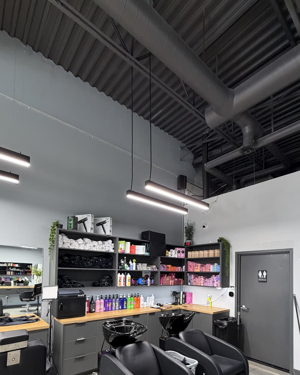 The wash stations and product wall on the Artistly floor