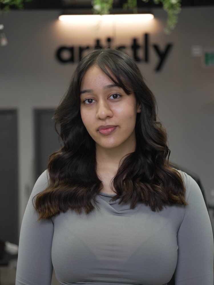 A long brunette blowout finished at Artistly
