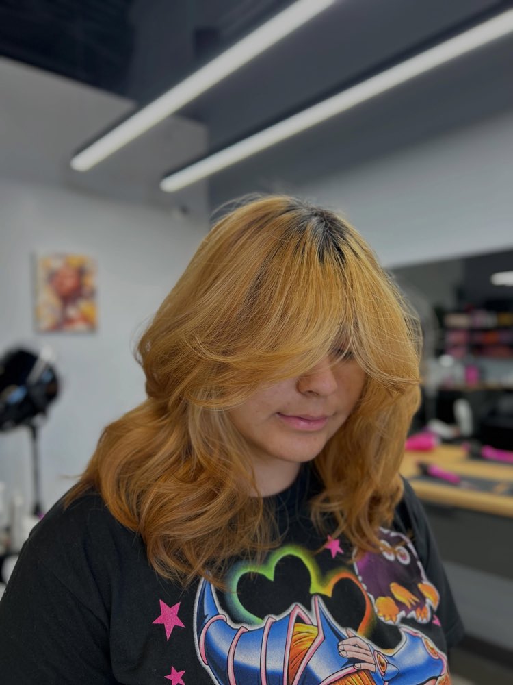 A soft copper fringe cut and styled at Artistly