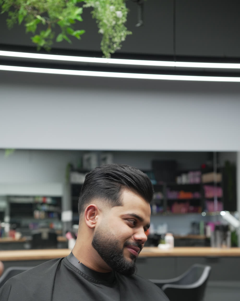 A men's cut in progress in the chair at Artistly